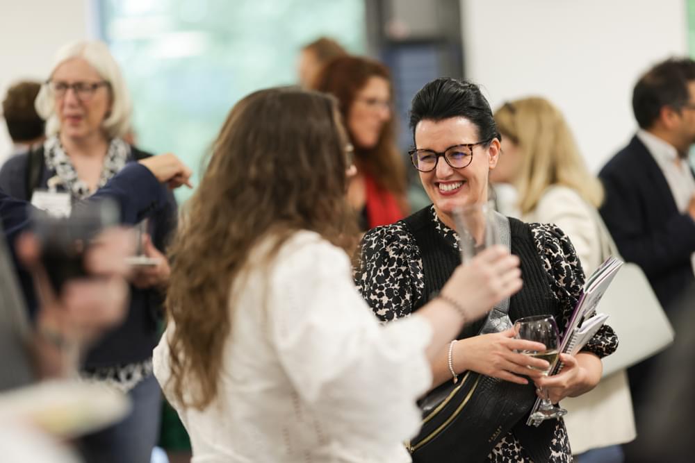 Two women networking at an event