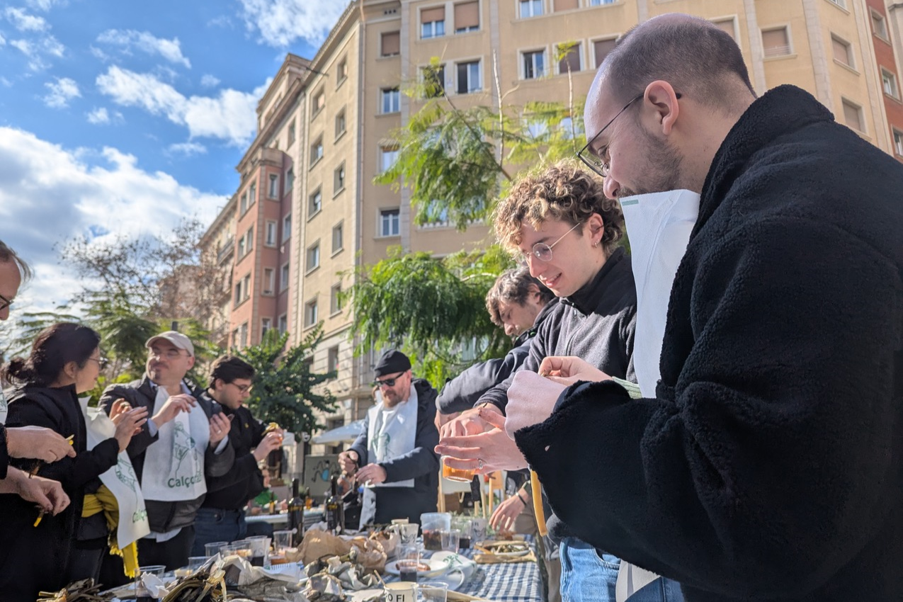 A group of people enjoying an open air city dining experience in Calcotada to celebrate the launch of RELISH
