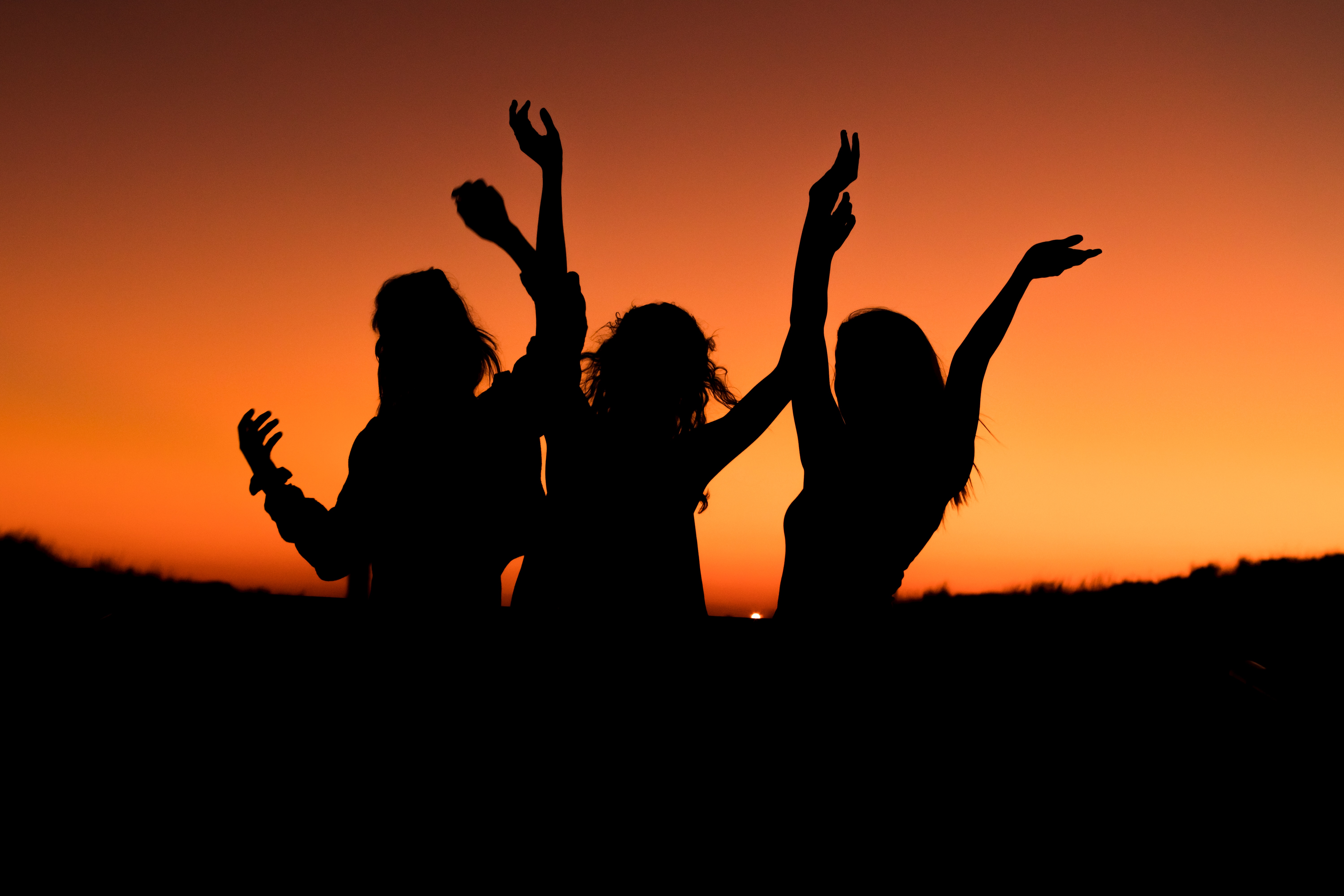 Silhouettes of Women celebrating