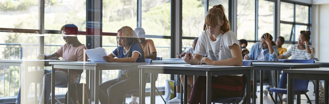students sitting working at desks