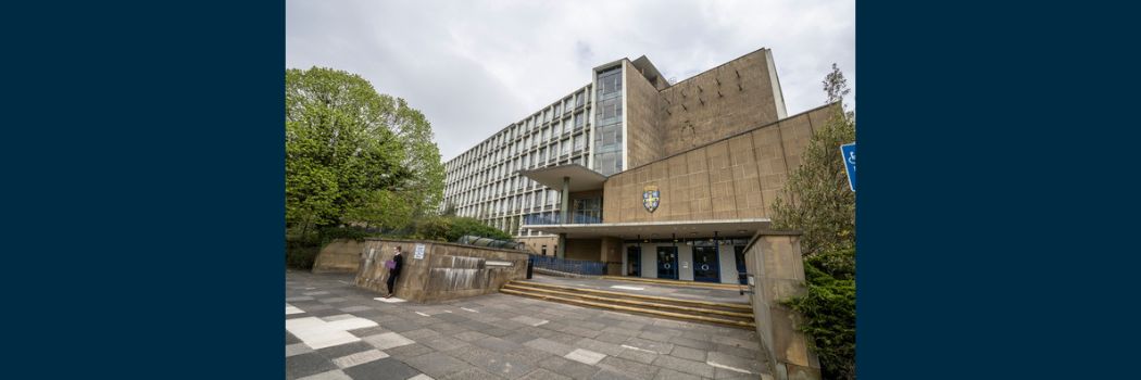 A 1960s office building, with steps up a front entrance