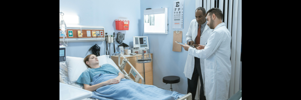 Doctors attending a patient in hospital