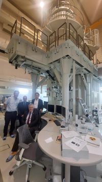 People in Science Institute with equipment in the background