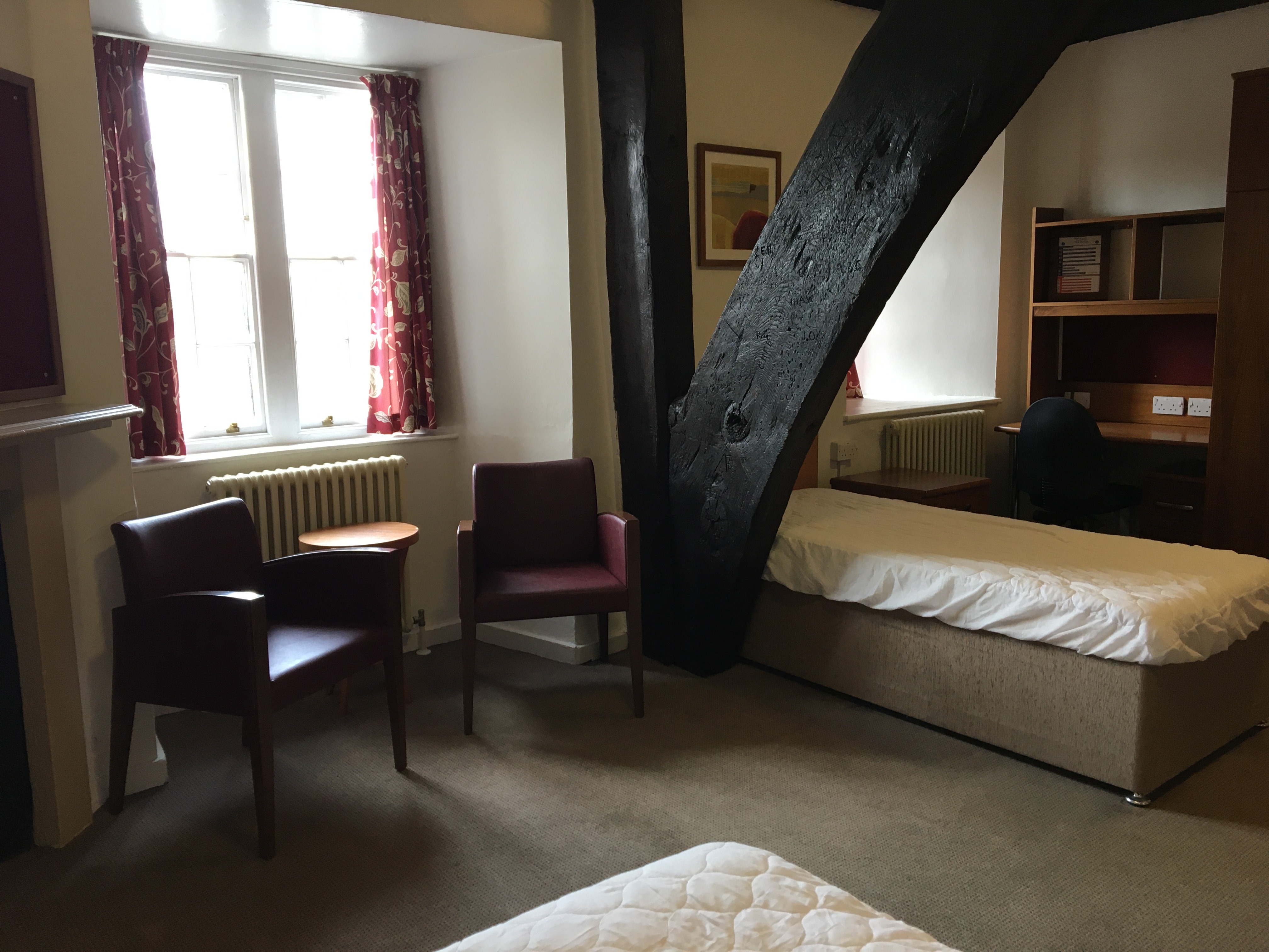 Shared room facility with bed and furniture