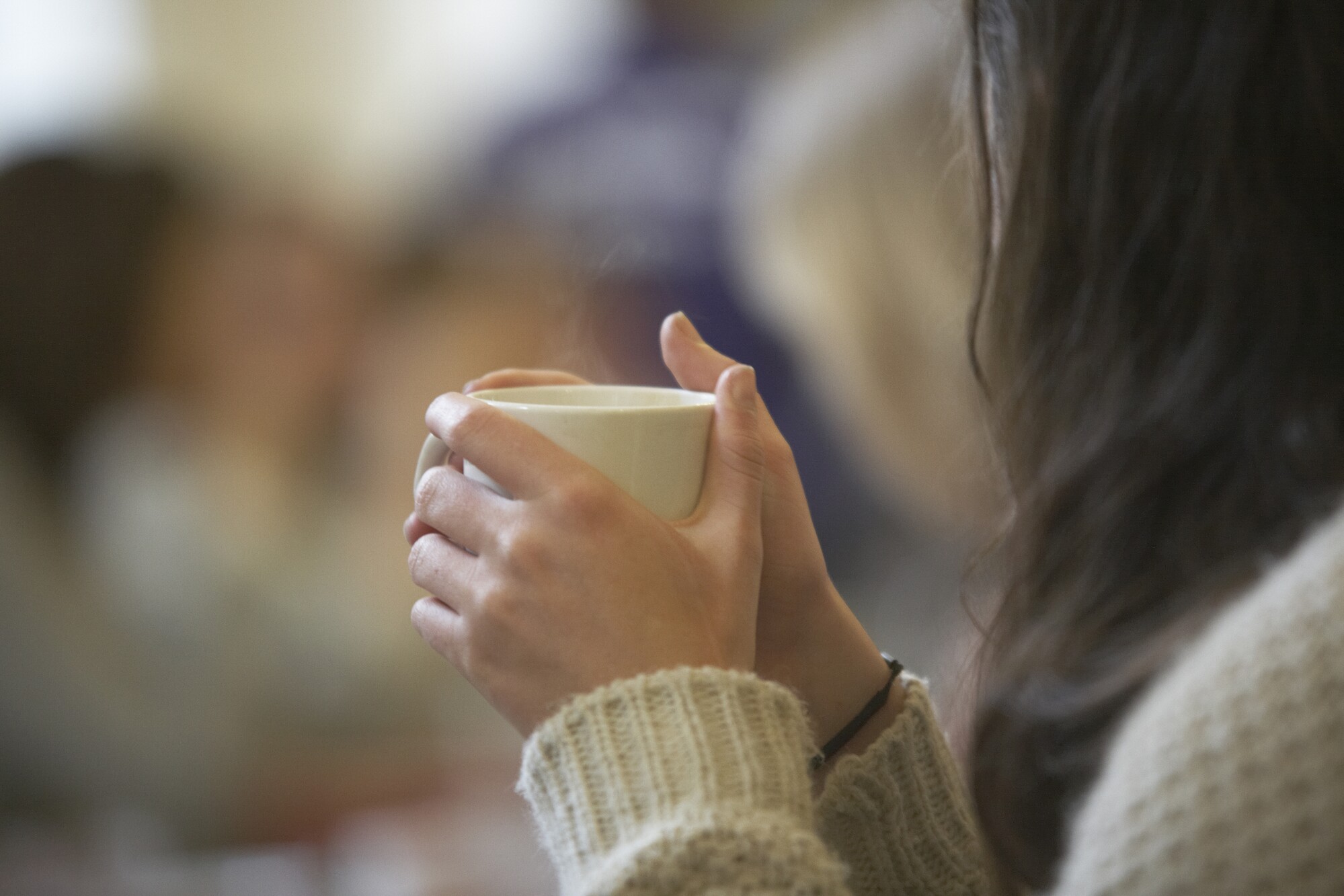 Woman holding a cup of coffee