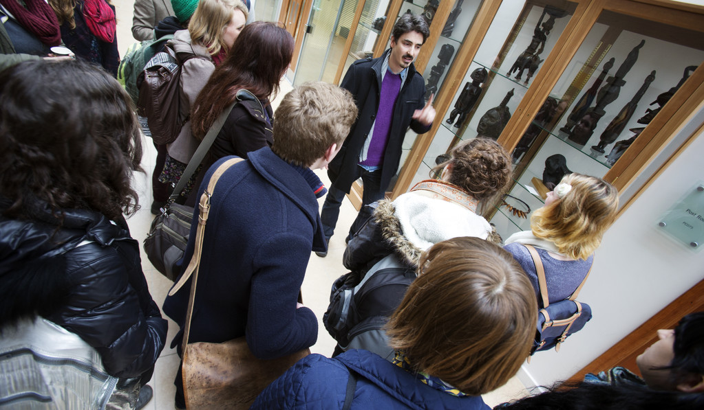 A groups of students listening in a museum
