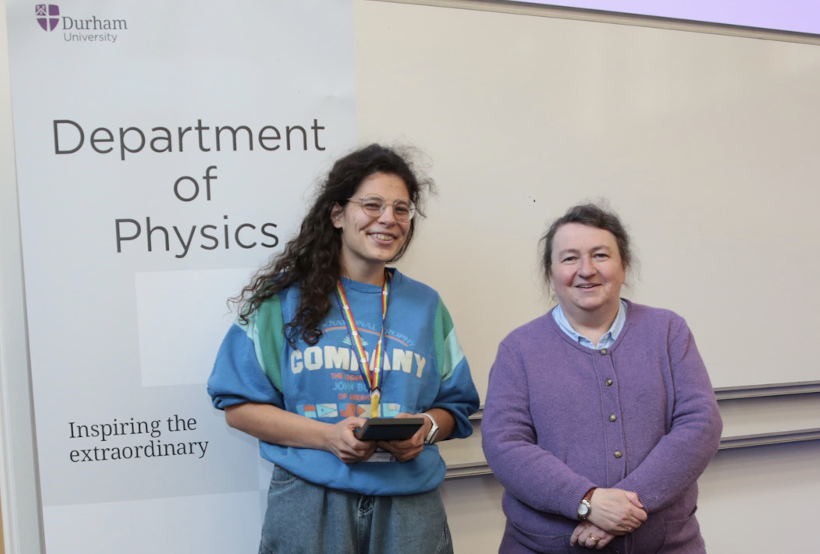 Perrine Lognone receiving a staff excellence award from Prof Paula Chadwick