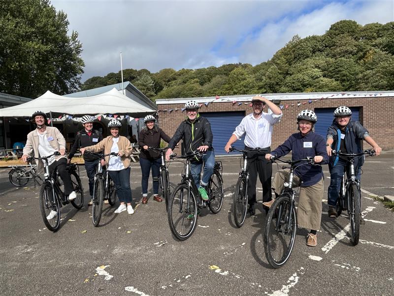 A group of cyclists posing for a picture