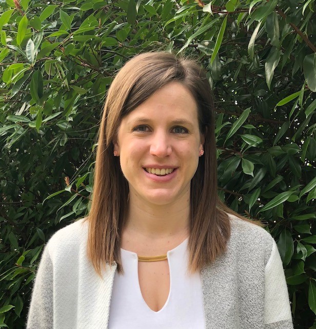 A woman smiling for the camera