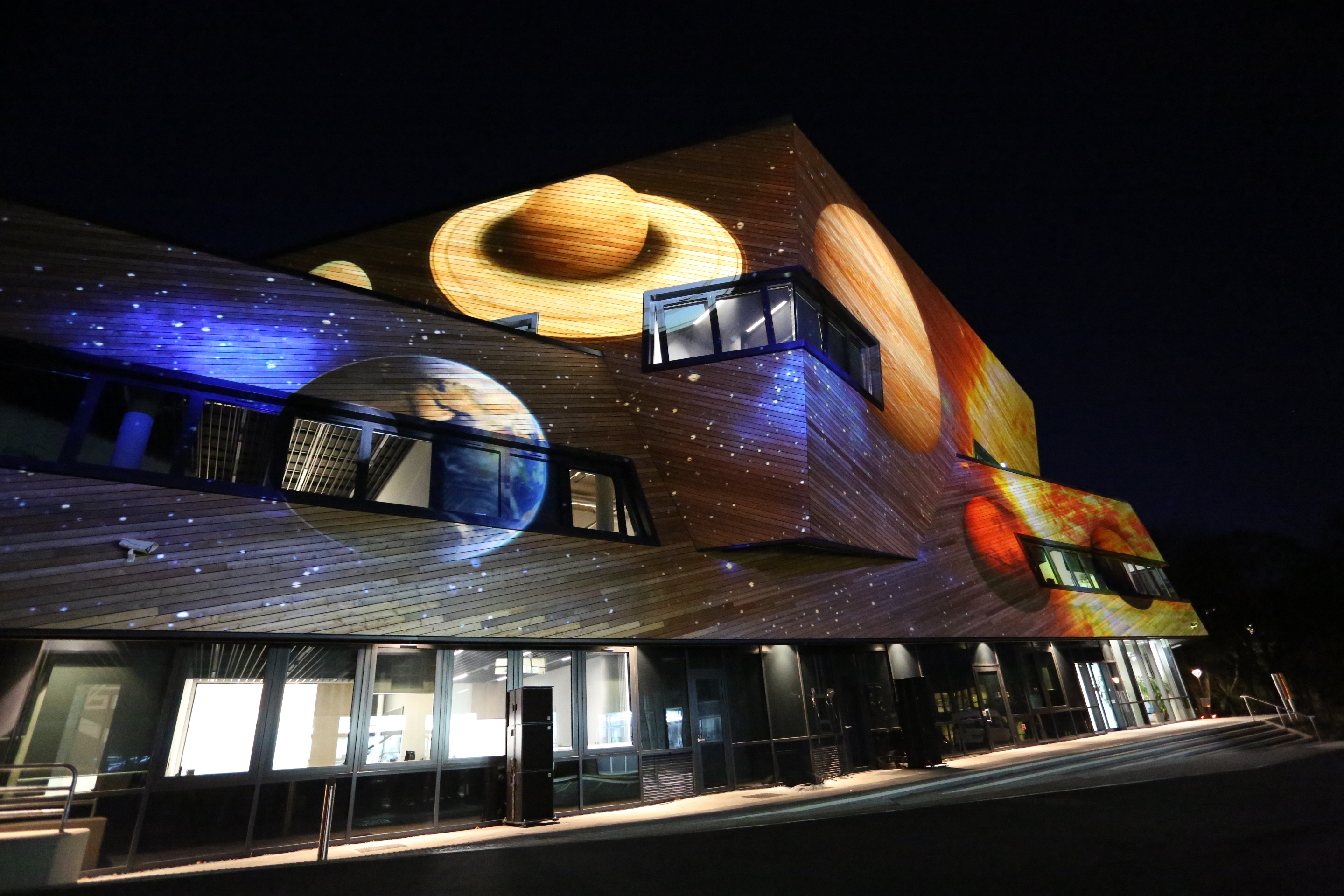 The Worlds, Systems & Creations projection featuring space and planets on The Ogden Centre for Fundamental Physics