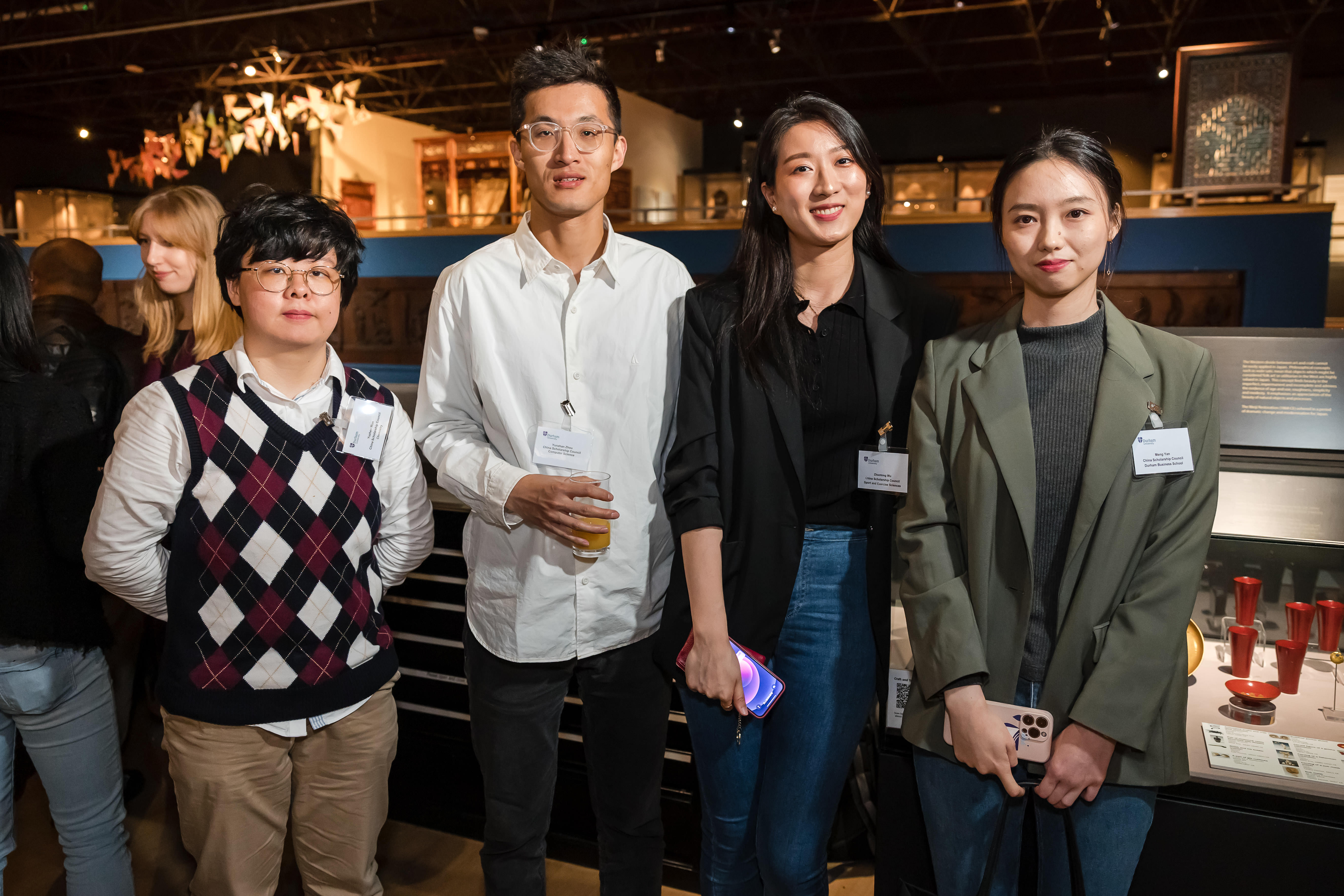 Four students looking at the camera