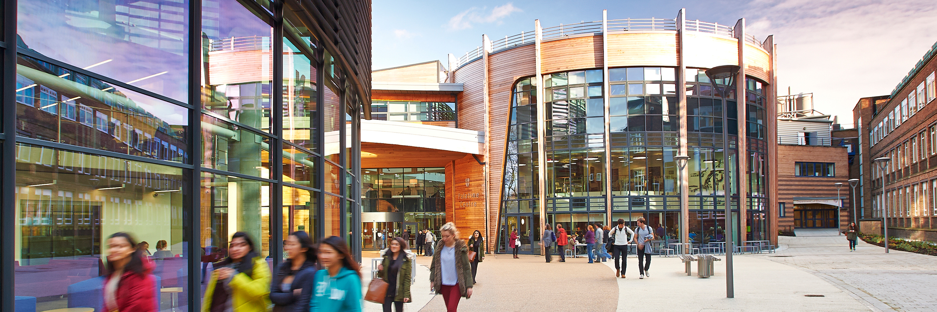 The exterior of the Palatine Centre, bustling with students between lessons