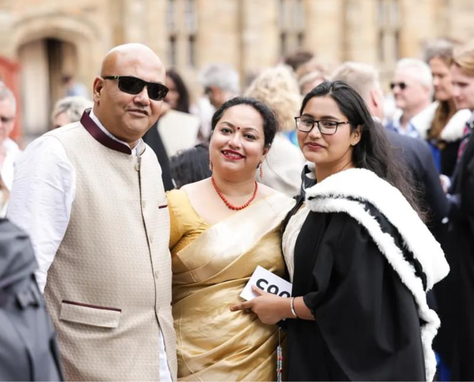 A graduating student and two guests