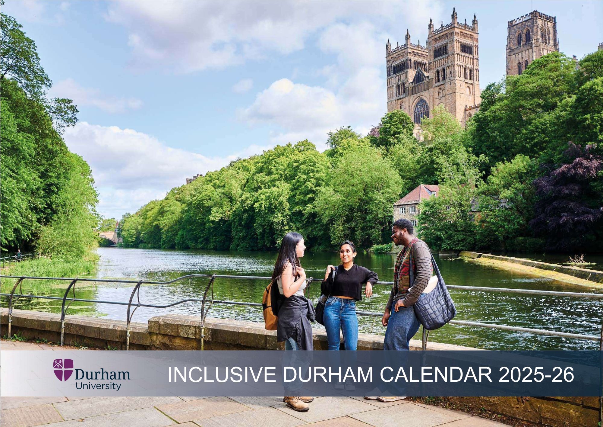 three students talk by the river in Durham, the cathedral is in the background