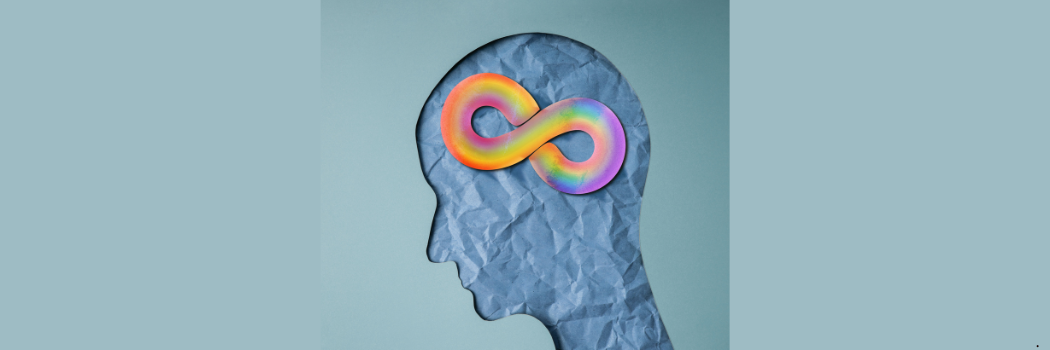 An image of the outline of a head containing a multi-coloured infinity symbol