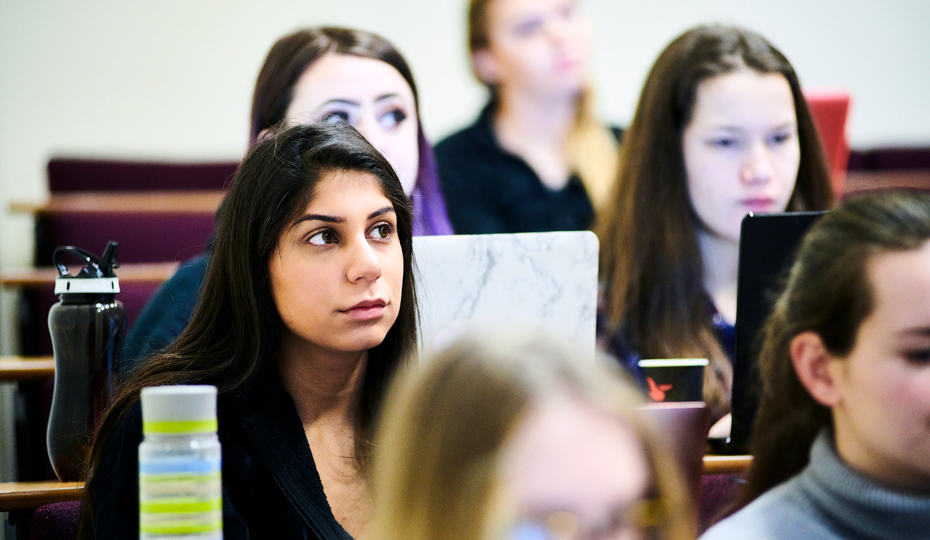 Students listen to a lecturer during a seminar