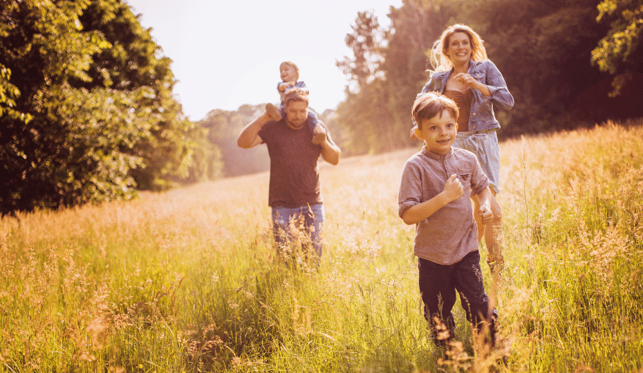 A family running in a field