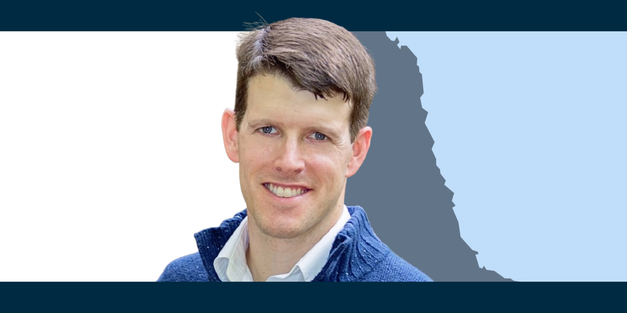 Brian Powers in front of an outline of the north east of England