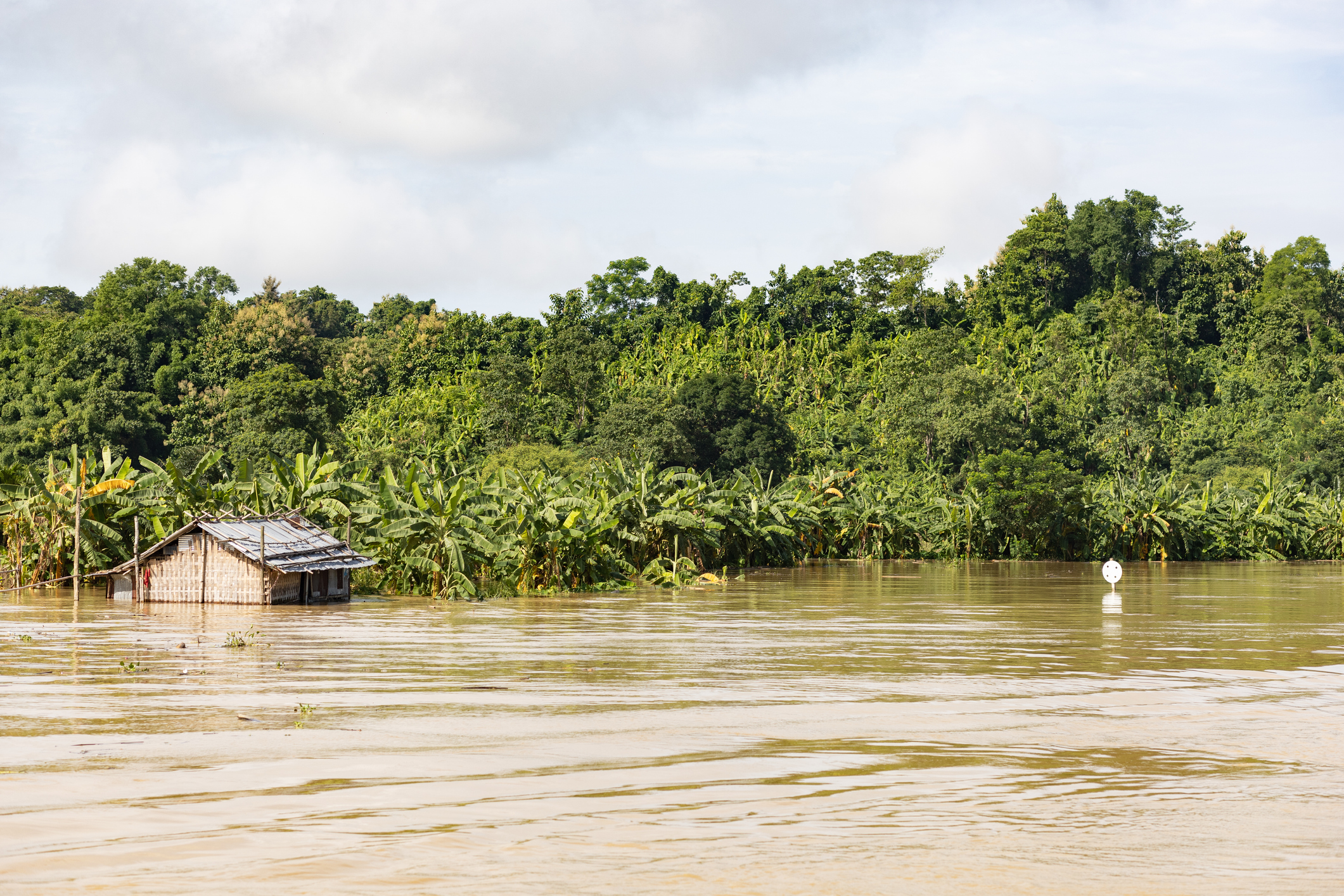 house in bangladesh almost submerged in flood water