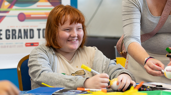 A girl paints a planet