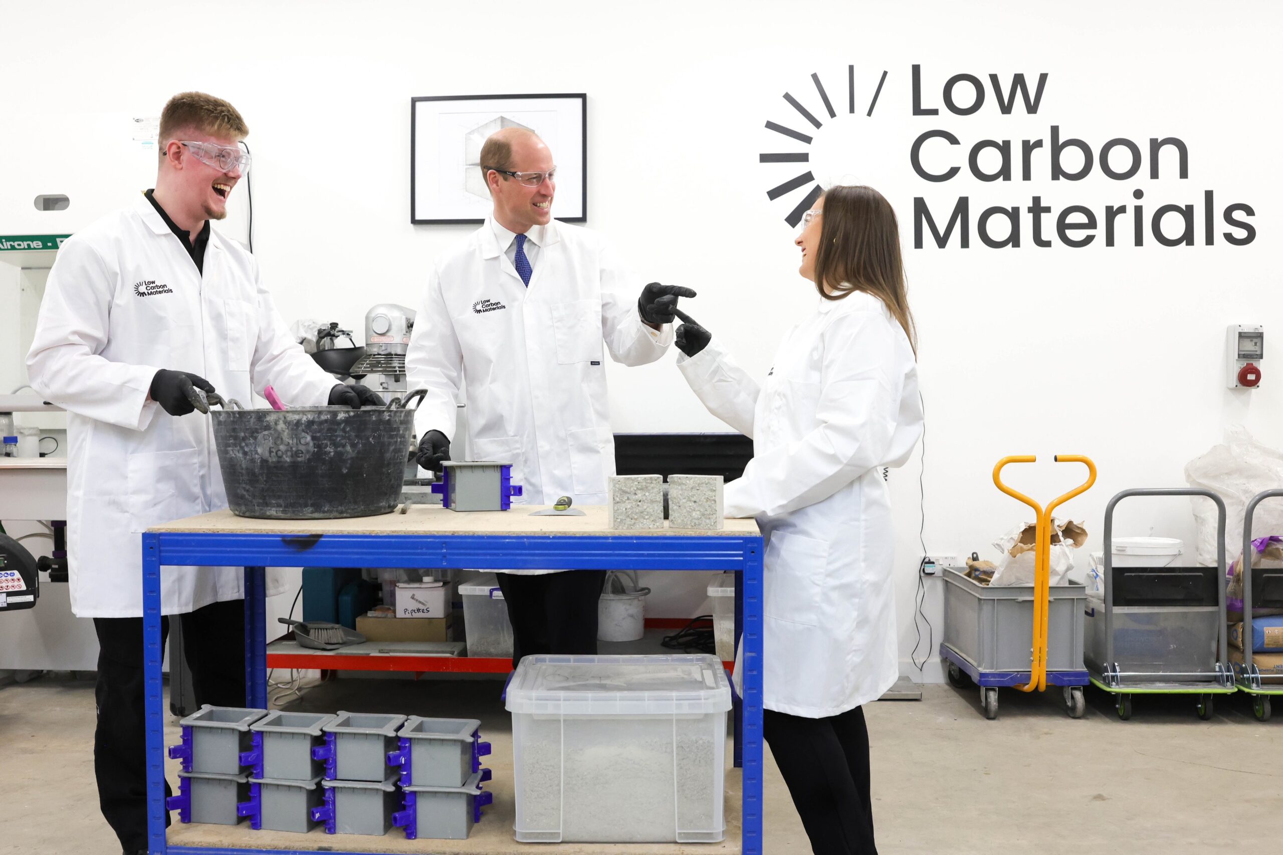 Low Carbon Material staff laughing with Prince William around a table